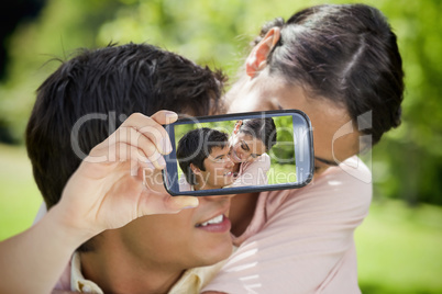 Couple taking selfie on smartphone