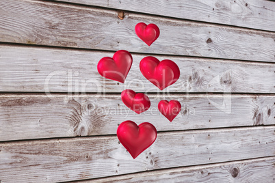 Composite image of floating love hearts