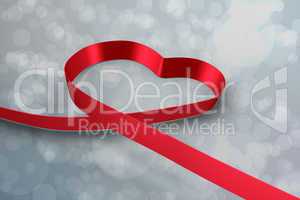 Large red ribbon in a heart shape