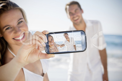 Couple taking selfie on smartphone