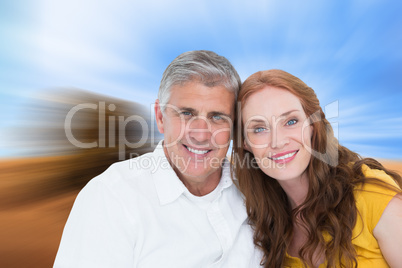 Composite image of casual couple smiling at camera