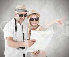 Composite image of happy tourist couple using map and pointing