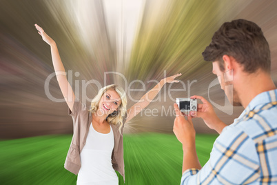 Composite image of man taking photo of his pretty girlfriend