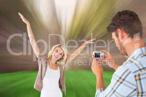 Composite image of man taking photo of his pretty girlfriend