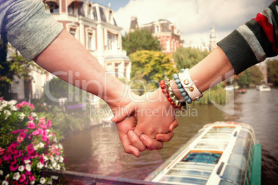 Composite image of students holding hands