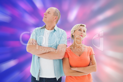 Composite image of thinking older couple with arms crossed