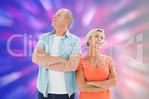 Composite image of thinking older couple with arms crossed