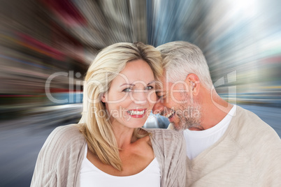 Composite image of happy couple laughing together woman looking