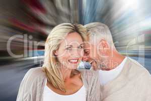 Composite image of happy couple laughing together woman looking