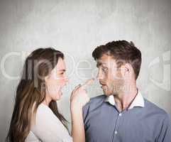 Composite image of casual young couple in an argument