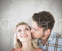 Composite image of handsome man kissing girlfriend on cheek