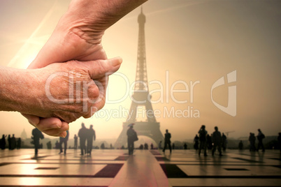 Composite image of elderly couple holding hands