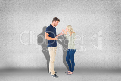 Composite image of young couple having an argument