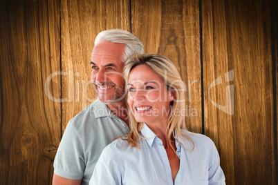 Composite image of happy couple smiling and embracing Composite image of happy couple smiling and embracing