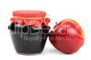 Red apple and pot of jam