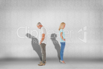 Composite image of unhappy couple not speaking to each other