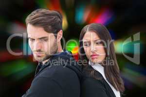 Composite image of unhappy couple not speaking to each other