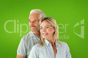 Composite image of happy couple smiling and embracing