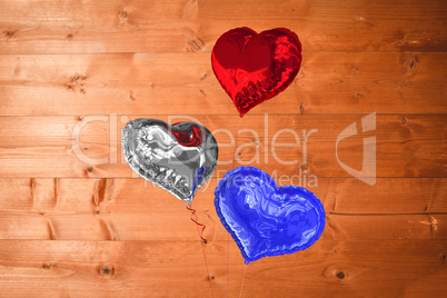 Composite image of heart balloons