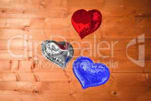 Composite image of heart balloons