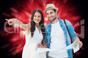 Composite image of happy hipster couple looking at map