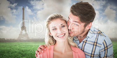 Composite image of handsome man kissing girlfriend on cheek