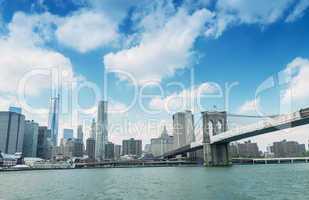 Magnificence of Brooklyn Bridge and Manhattan skyline over East