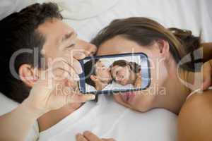 Couple taking selfie on smartphone