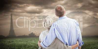 Composite image of mature couple hugging and looking