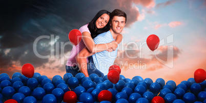 Composite image of young man giving girlfriend a piggyback ride