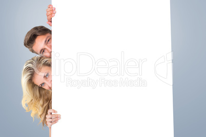 Composite image of attractive young couple smiling at camera