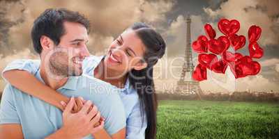 Composite image of cute couple smiling at each other