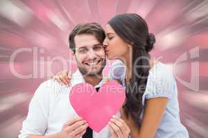 Composite image of pretty brunette giving boyfriend a kiss and h