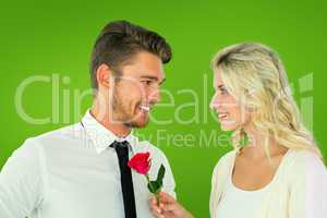 Composite image of handsome man smiling at girlfriend holding a