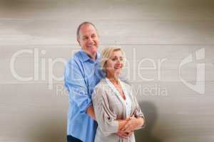 Composite image of happy mature couple embracing each other