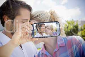 Couple taking selfie on smartphone