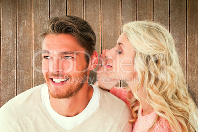 Composite image of attractive blonde whispering secret to boyfri