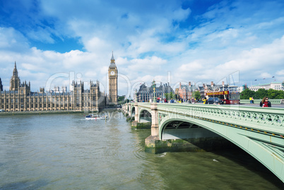 LONDON - SEPTEMBER 27, 2013: Tourists walk along Westminster Bri