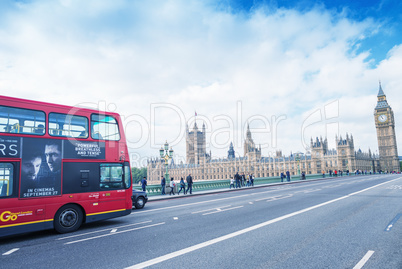 LONDON - SEPTEMBER 27, 2013: Tourists walk along Westminster Bri