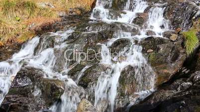 Beautiful veil cascading waterfall, mossy rocks