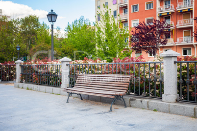 Bench in front of a typical residatial building in Madrid