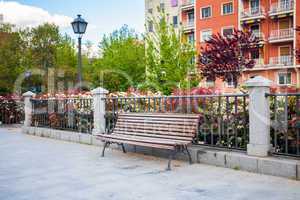 Bench in front of a typical residatial building in Madrid