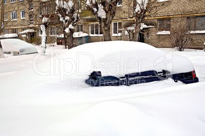 Car buried in snow