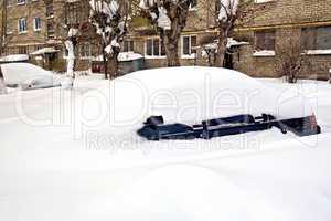 Car buried in snow