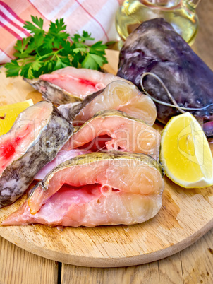 Catfish raw with lemon on board