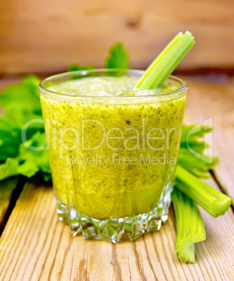 Cocktail with celery in glassful on board