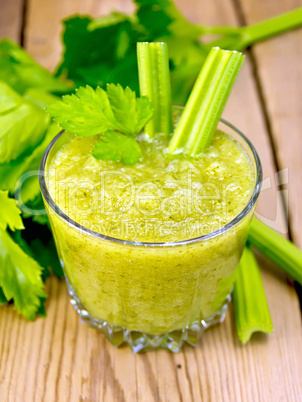 Cocktail with celery in low glassful on board
