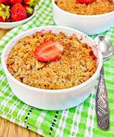 Crumble strawberry on green napkin with spoon