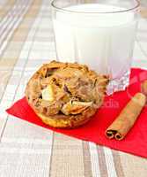 Cupcake rye with apples on paper napkin with milk