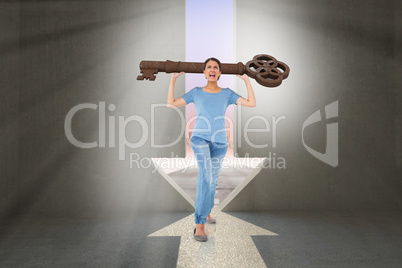 Composite image of annoyed brunette carrying large key